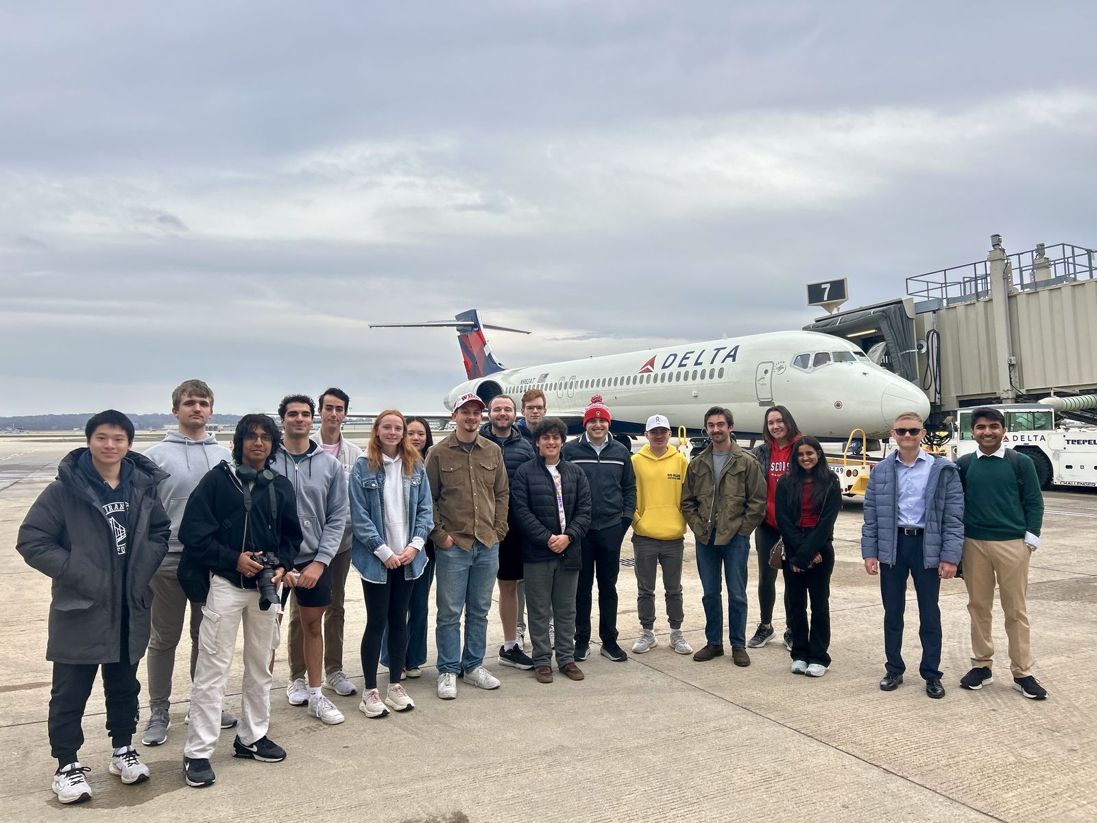 Aviation Club members on the ramp in front of a Delta jet during the MSN airport tour